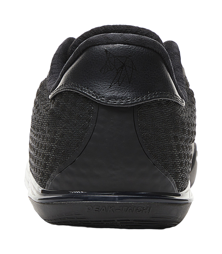 Black basketball shoe heel with logo patch and curved midsole