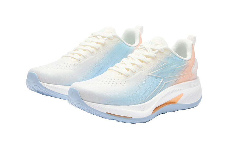 Pair of women's low-top running shoes, white with light-blue overlays, lace-up, orange accent