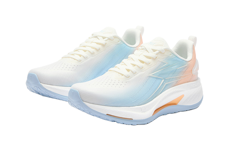 Pair of women's low-top running shoes, white with light-blue overlays, lace-up, orange accent