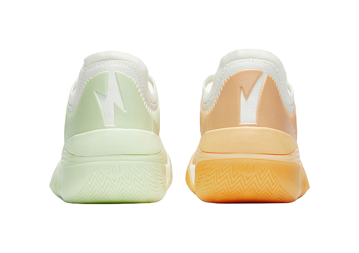 Pair of low basketball shoes: mint green left shoe, orange heel and sole on right