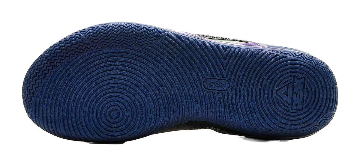Basketball shoe outsole tread in dark blue with circular traction pattern