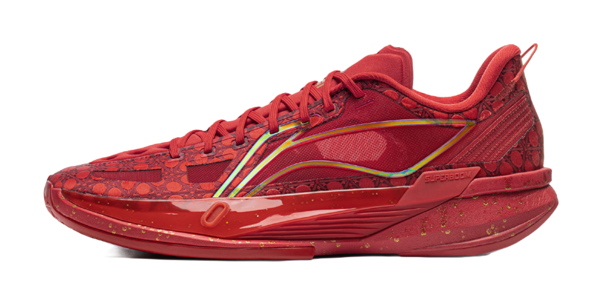 Unisex low basketball shoe, red patterned upper, lace-up, multicolor stripe detail
