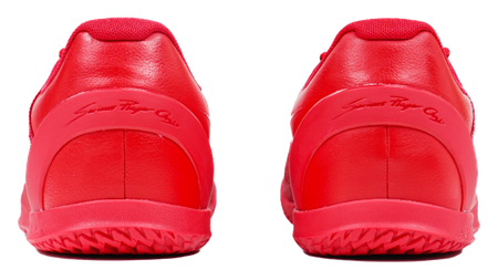 Red basketball shoes with smooth leather-like heel panels and rubber heel outsole