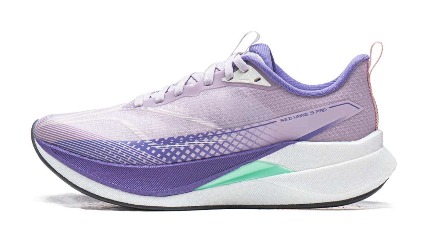 Lavender purple and white running shoe with green heel accent and purple sole