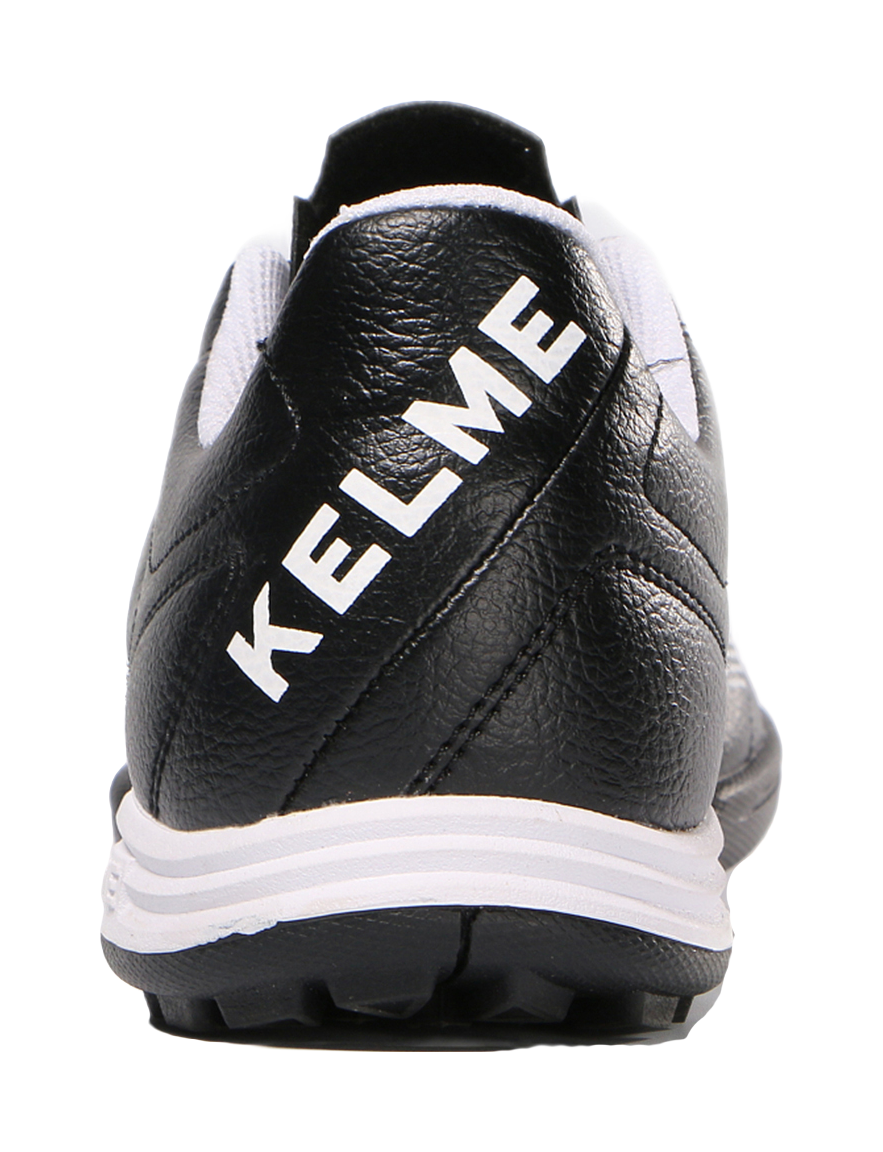 Black training soccer shoe heel with KELME logo lettering and white outsole edge