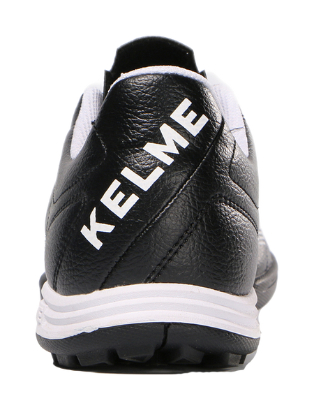 Black training soccer shoe heel with KELME logo lettering and white outsole edge