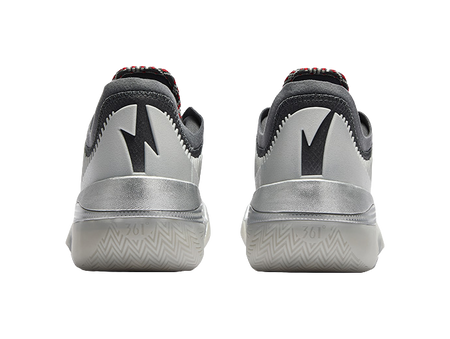 Low-top basketball shoe heel view with black collar and silver back panels