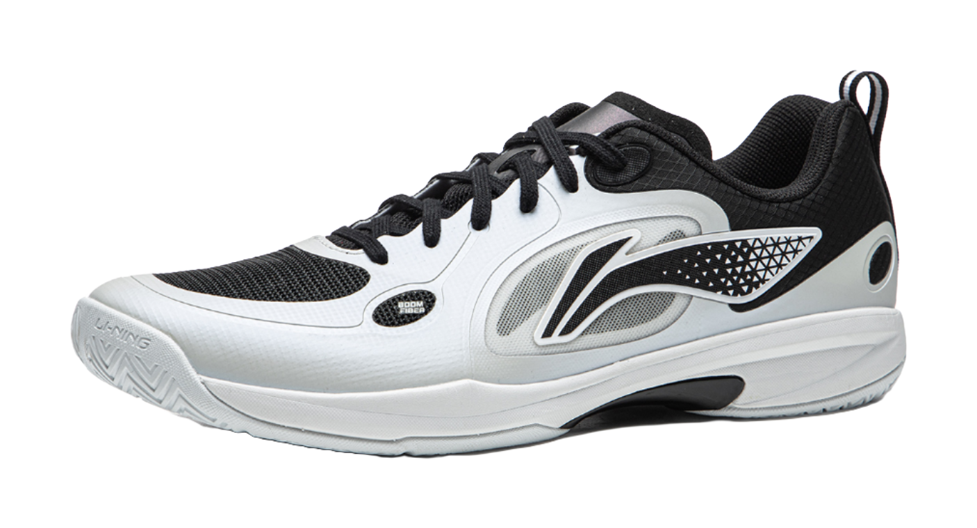 Table tennis shoe with black and gray upper panels, white laces, and side logo