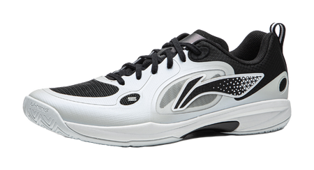 Table tennis shoe with black and gray upper panels, white laces, and side logo