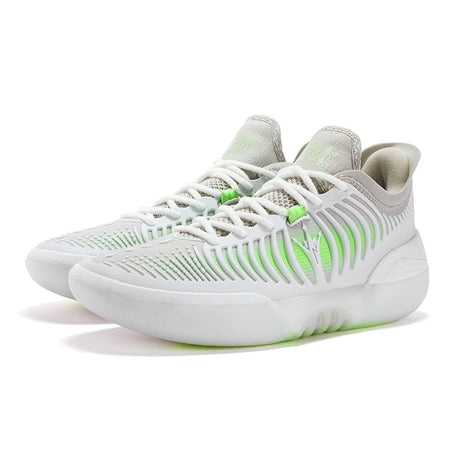 Basketball shoes, angled view: white mesh upper with green accents, lace-up, cushioned sole