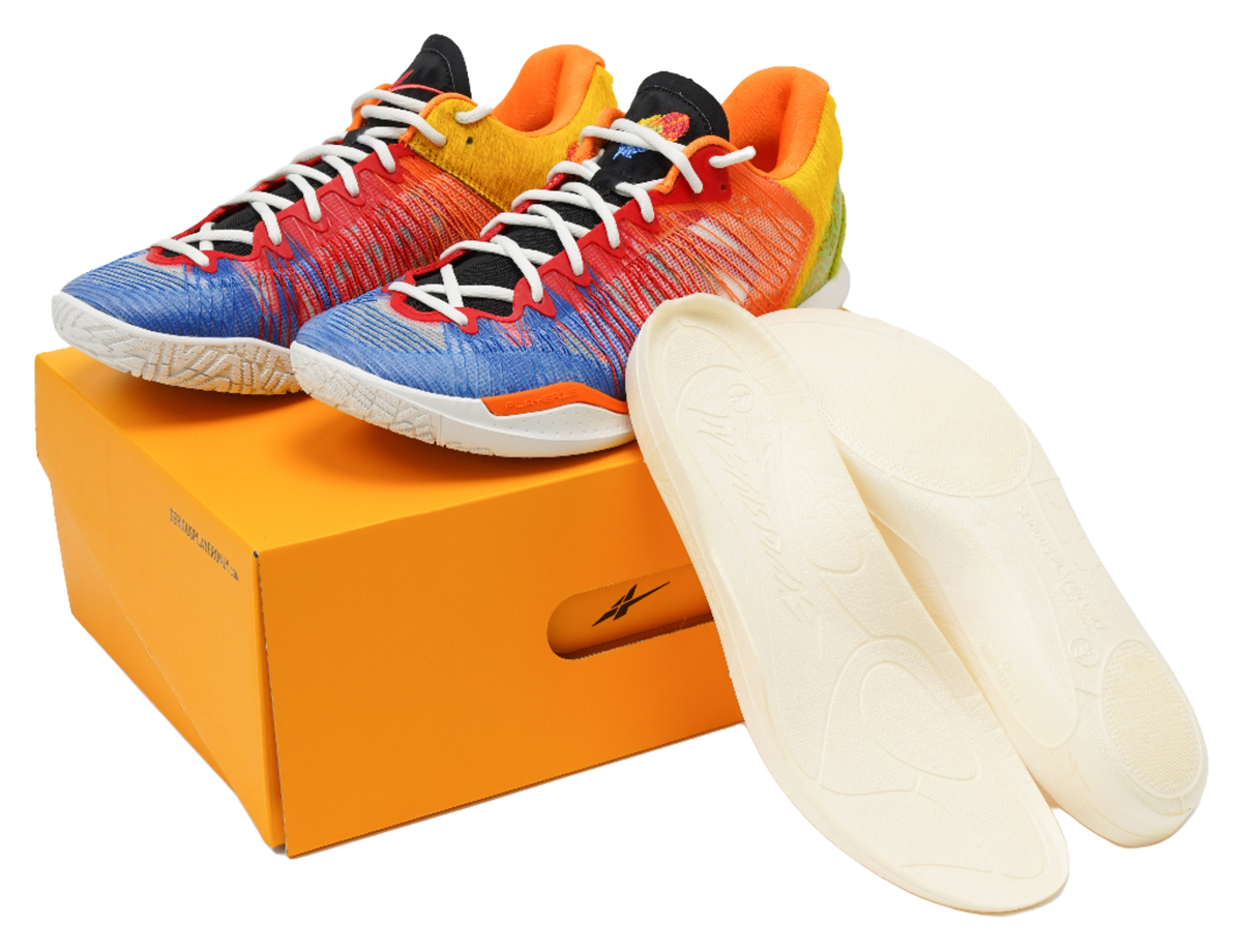Multicolor low-top basketball shoes on an orange box with Nike swoosh on insole