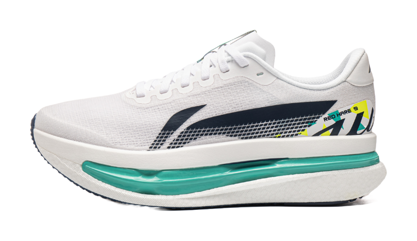 White knit running shoe with dark blue side panel and teal midsole