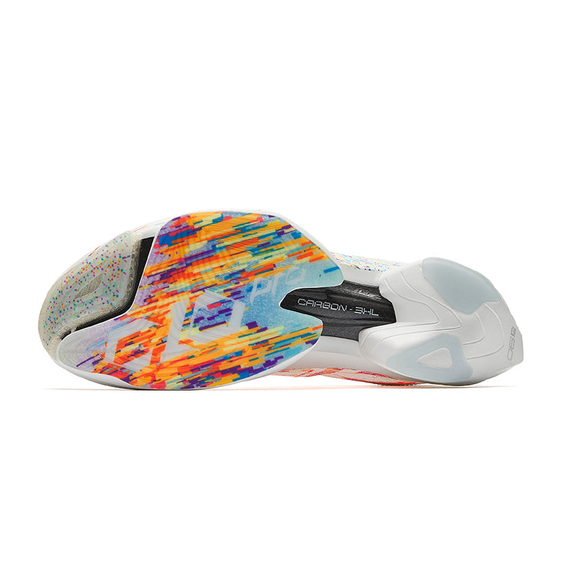 White shoe sole and underside with multicolor graphic tread and streamlined rocker