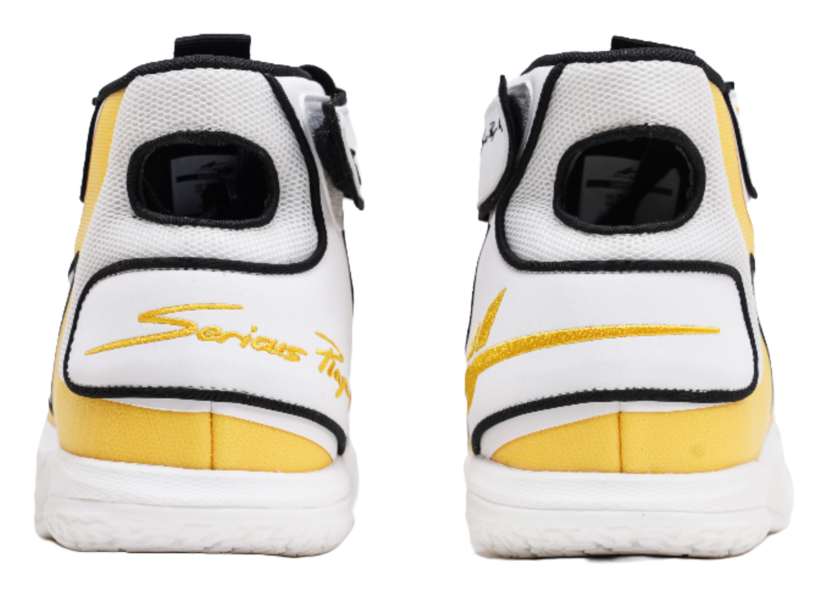High-top basketball shoe heel view, white with yellow stripe and black collar trim
