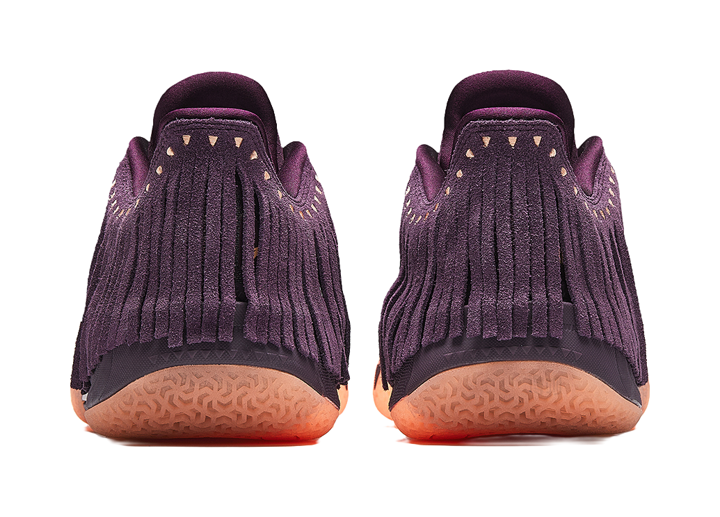 Purple basketball shoe heel view, fringe collar and grippy orange-tinted outsole
