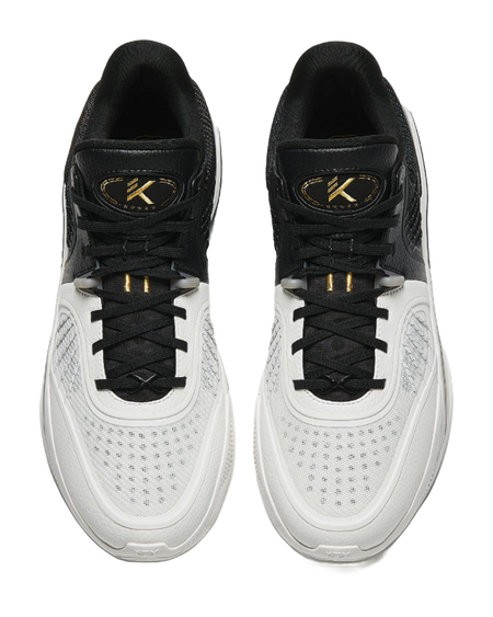 White and black high-top basketball shoes with black laces and padded collars