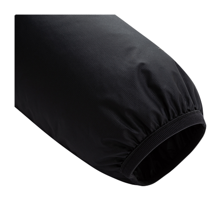 Black padded jacket sleeve with ribbed elastic cuff.