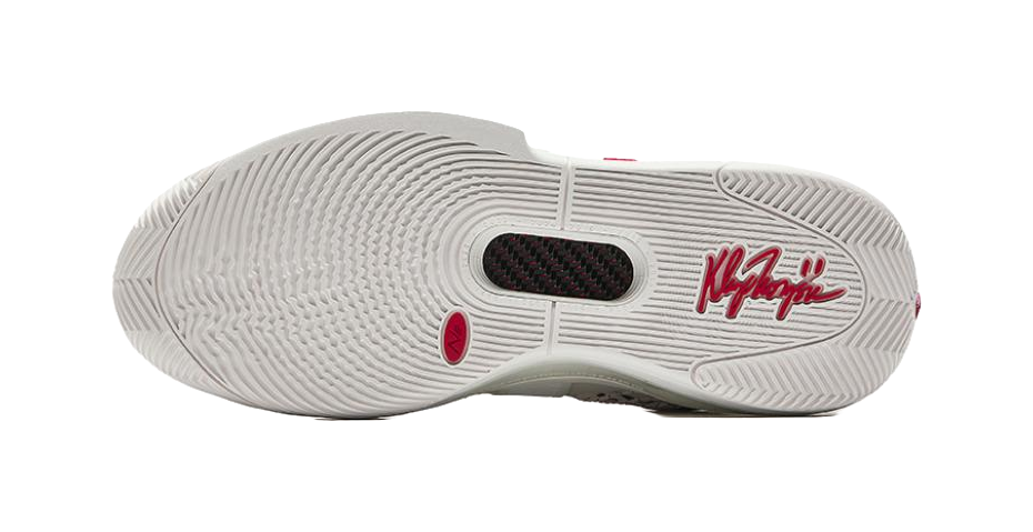 White basketball sneaker outsole with traction tread and logo markings