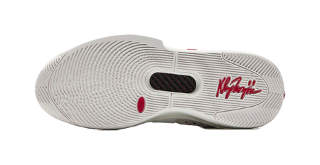 White basketball sneaker outsole with traction tread and logo markings