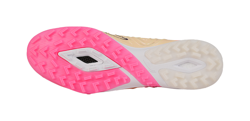 Turf soccer shoe outsole view with pink tread and white sidewalls, cleat studs