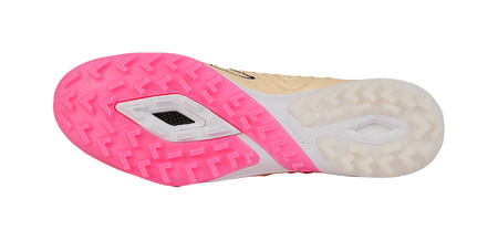Turf soccer shoe outsole view with pink tread and white sidewalls, cleat studs