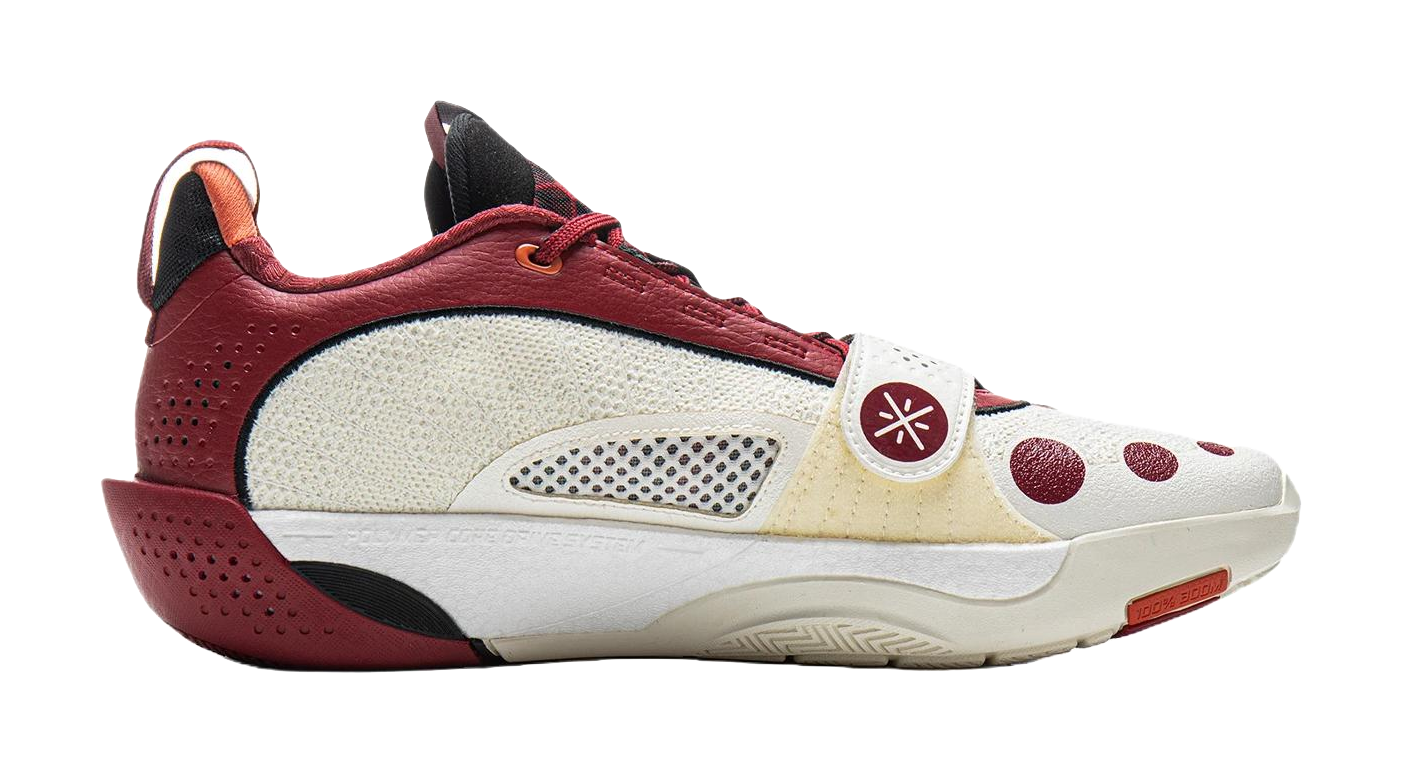 Red and white basketball shoe with mesh side panels, lace-up front, and low sole