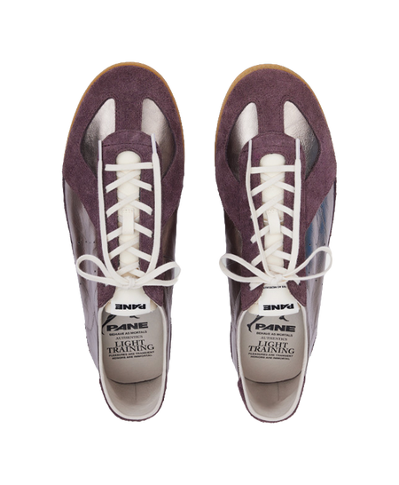 Pair of low-cut training shoes with white laces and PANE Light Training tongue label.
