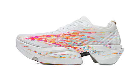 White racing shoe with orange and purple splatter graphics, white midsole.