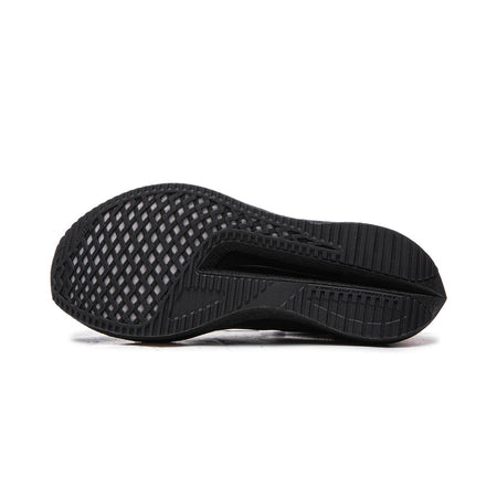 Black running shoe outsole view with textured rubber traction pattern