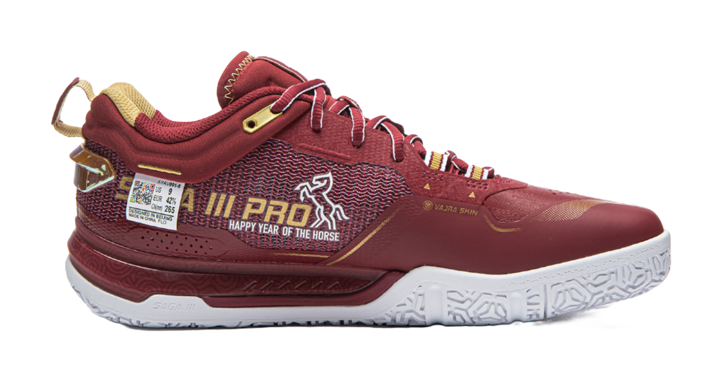 Red badminton shoe side view with patterned knit upper, white sole, and lace-up closure.
