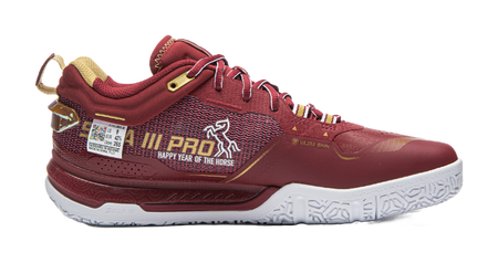 Red badminton shoe side view with patterned knit upper, white sole, and lace-up closure.