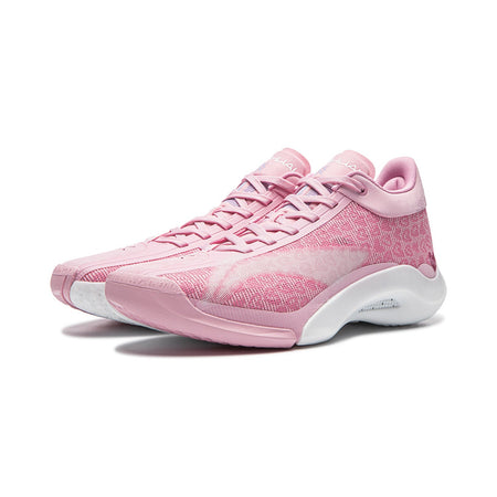 Pink lace-up basketball shoe with white midsole and textured forefoot detail