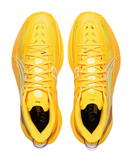 Pair of yellow basketball shoes, front view with lace-up uppers