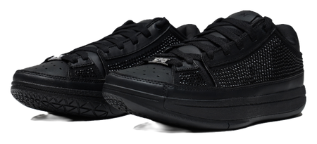 Black lace-up basketball shoes with textured upper and thick rubber sole, angled view.