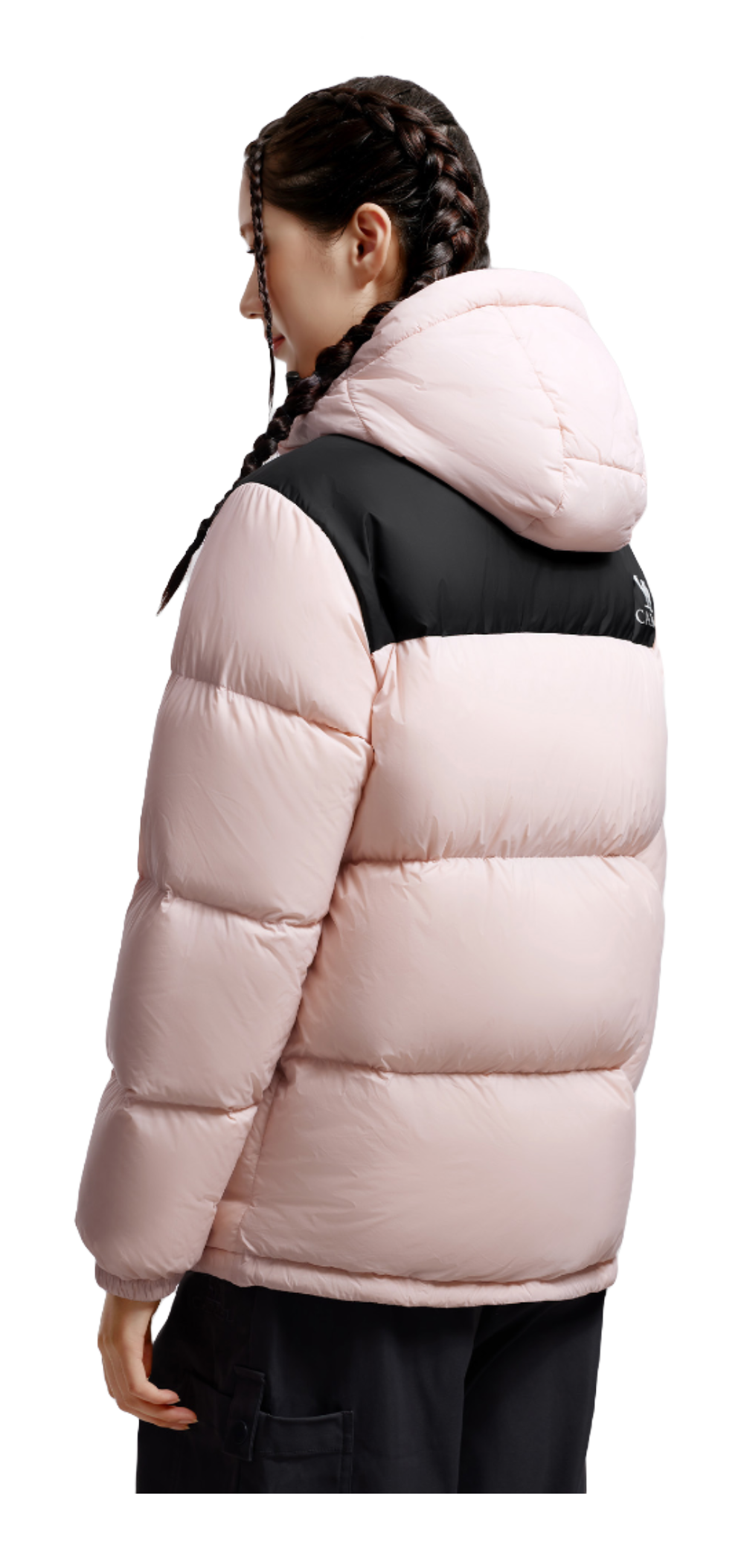 Model wearing unisex pink hooded puffer down jacket in side view with black chest panel
