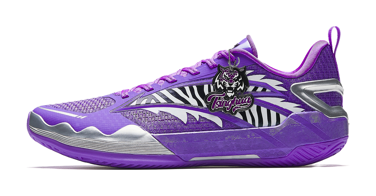 Purple and white basketball shoe with knit upper, lace-up front, and padded collar.