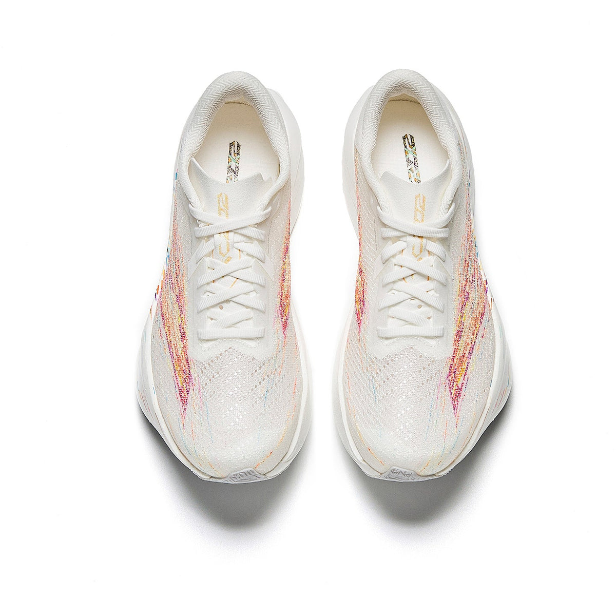 Women's running shoes, front view with white laces and multicolor paint-splatter upper