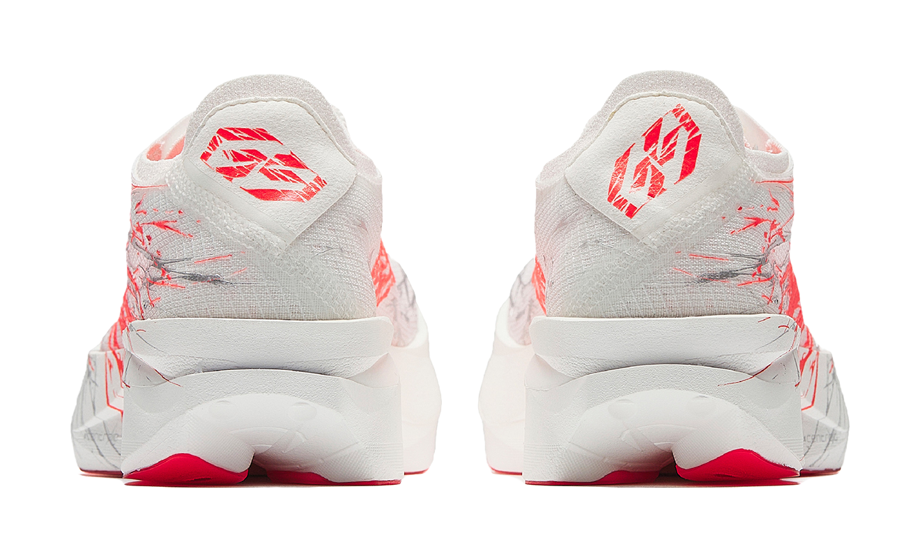 Anta women’s running shoe in white with red heel details and red graphic accents