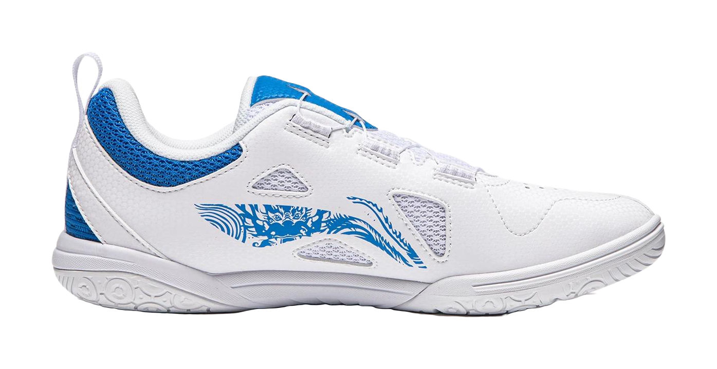 White table tennis shoe with blue heel panel, side graphic, and textured rubber outsole.