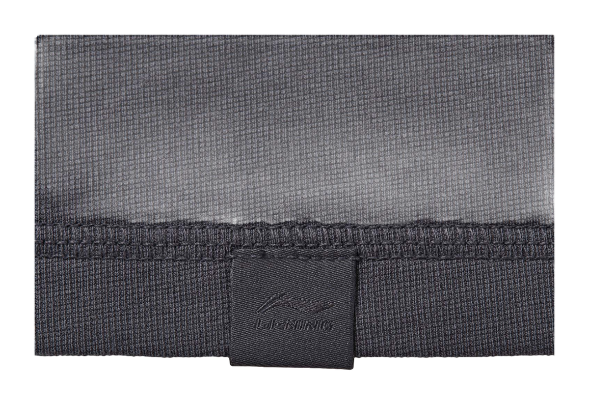 Gray textured T-shirt hem with inner neck tag and stitched seam