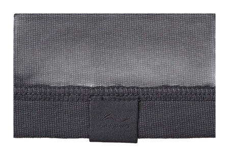 Gray textured T-shirt hem with inner neck tag and stitched seam