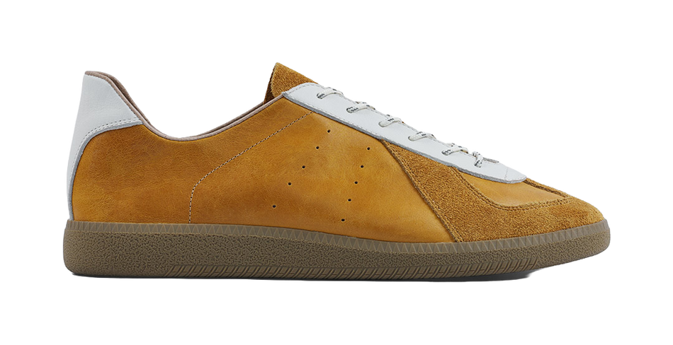 Tan suede low-top sneakers with white panels, lace-up front, textured rubber sole