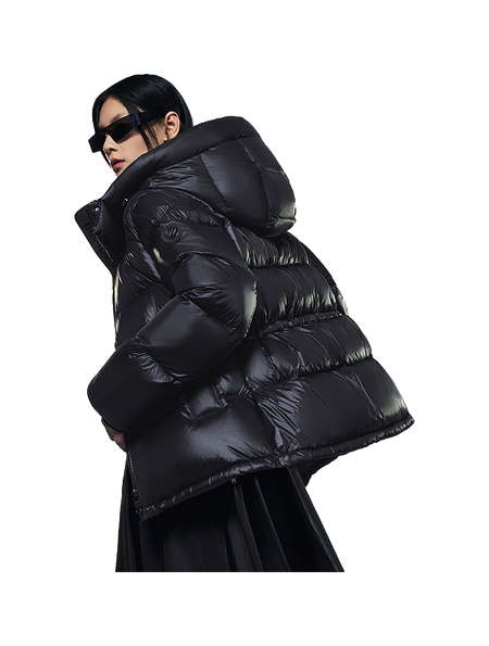 Black hooded puffer winter down jacket with large quilted sections and hood up