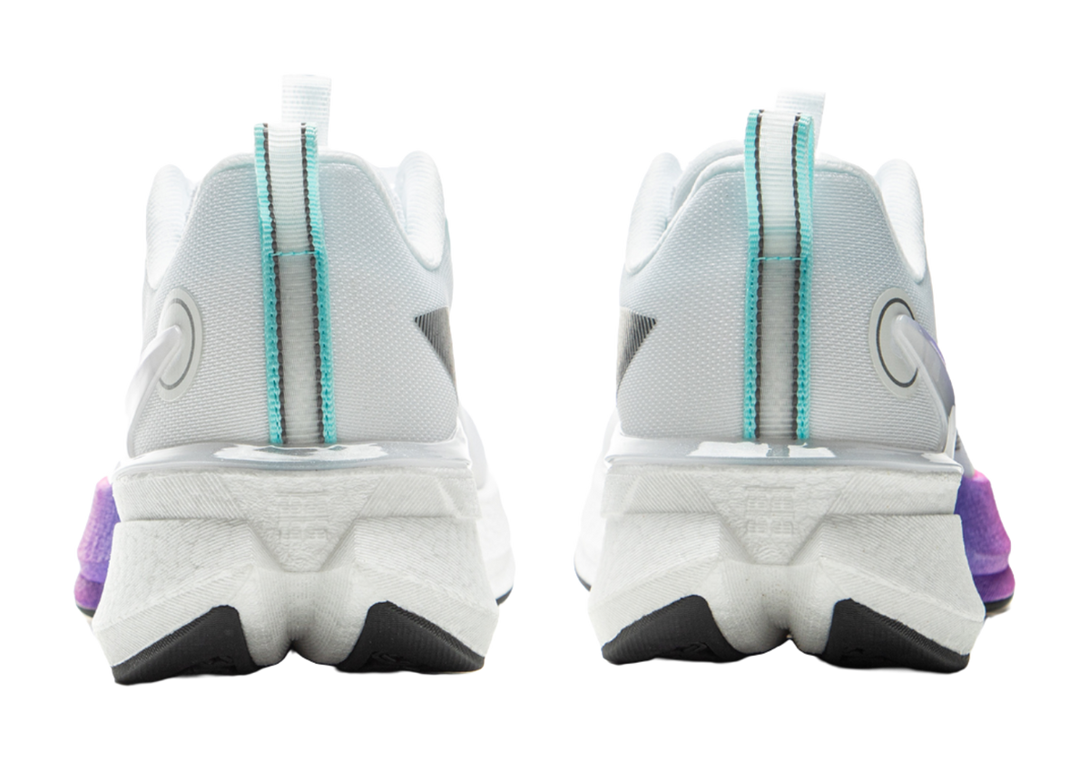 White running shoe heel view with teal pull tabs and cushioned back
