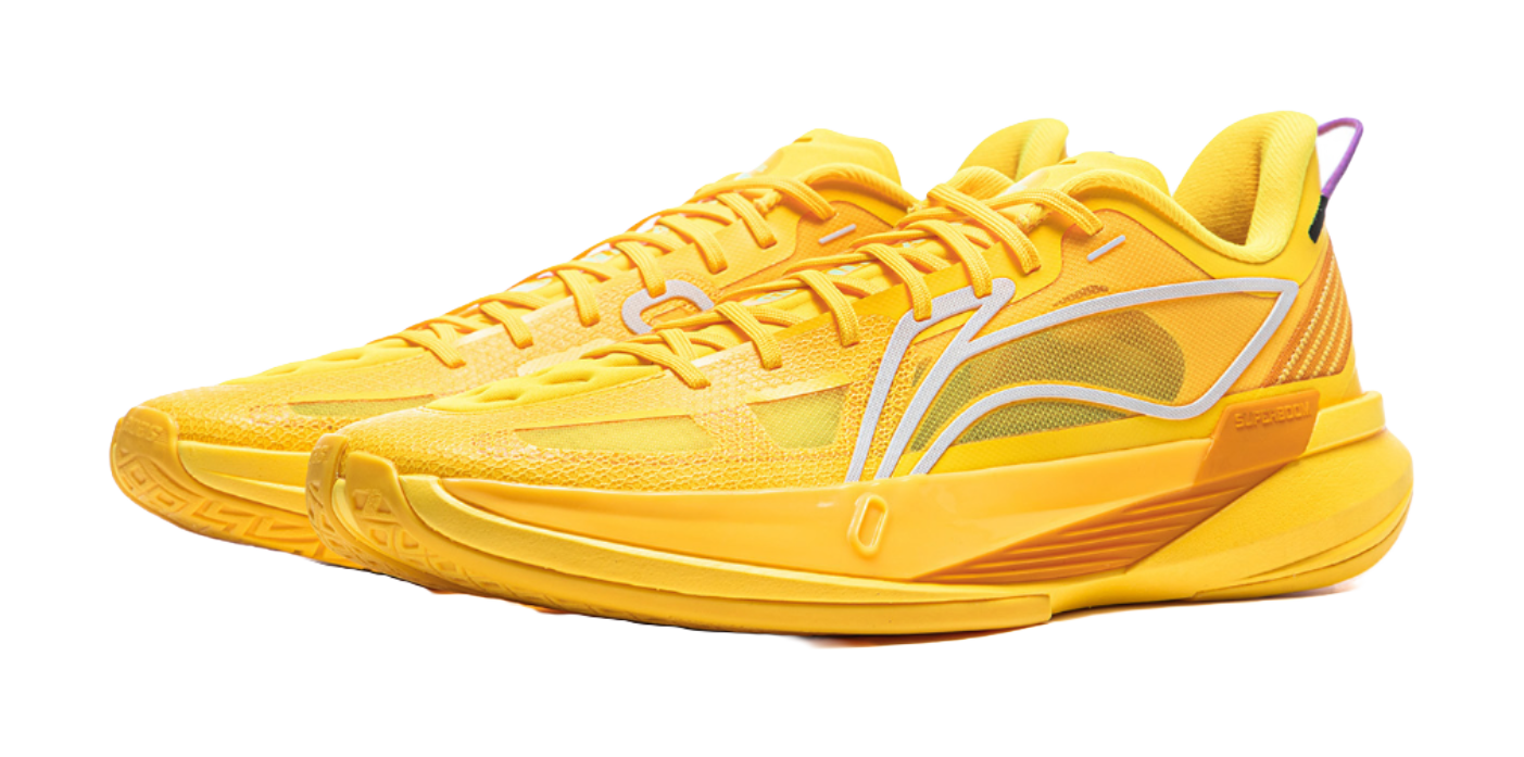 Yellow basketball shoe with white curved side stripe and cushioned sole