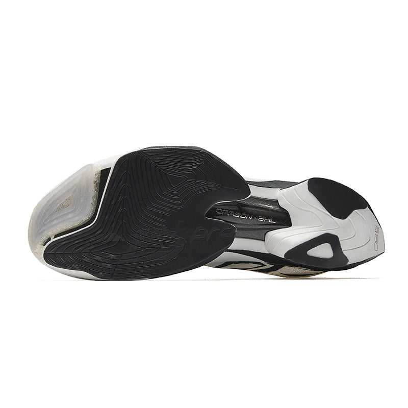 Unisex running shoes with black traction outsole and white upper, underside view.