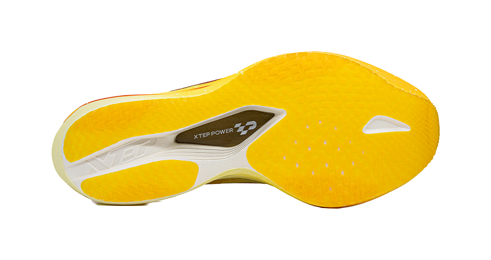 Racing shoe outsole with yellow textured tread and XTEP POWER logo, white details.