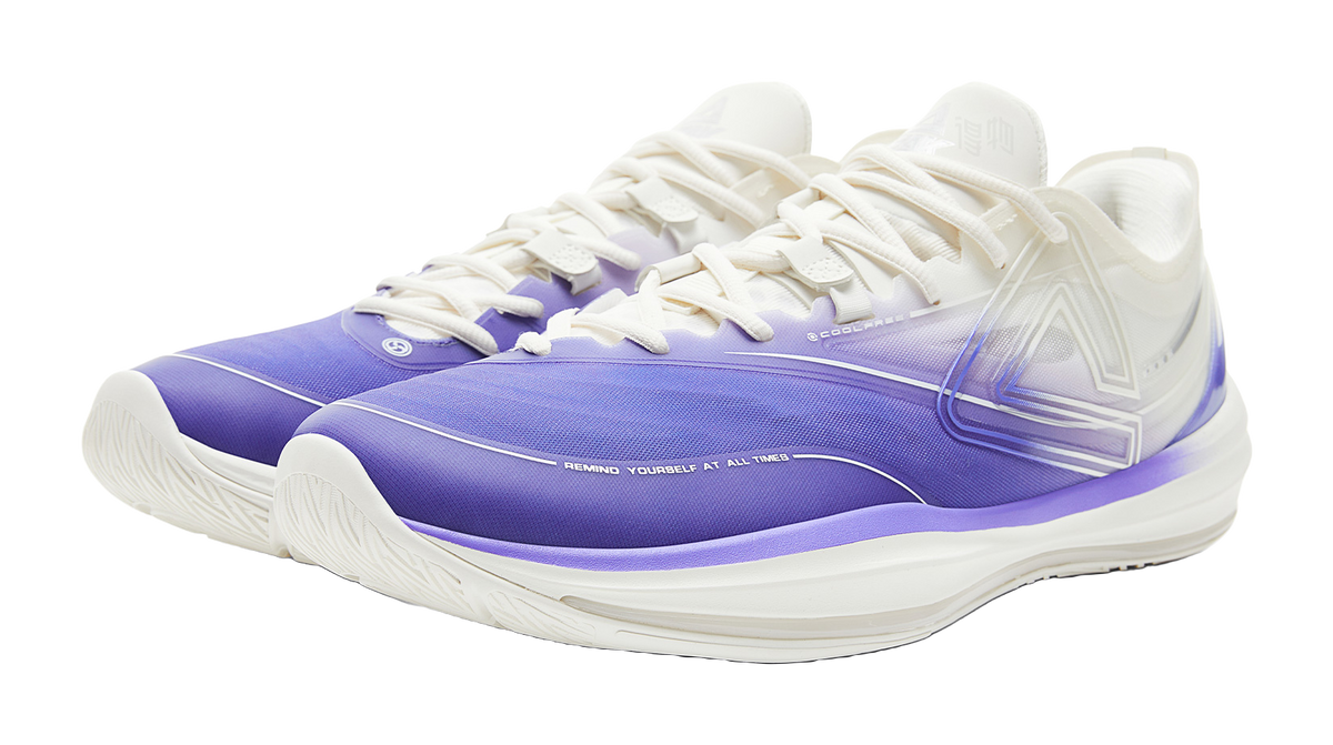 Lightweight basketball shoe with purple toe cap and white lace-up upper