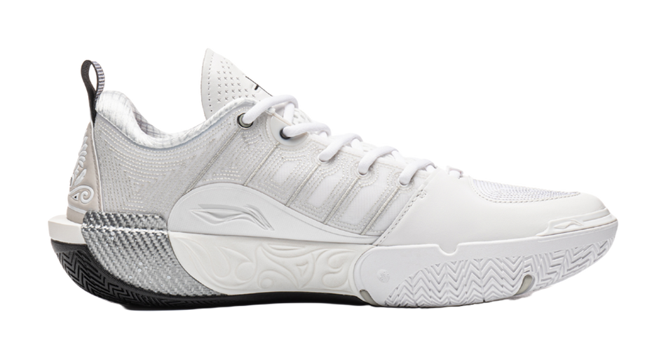 White basketball shoe side view with textured midsole and ankle collar