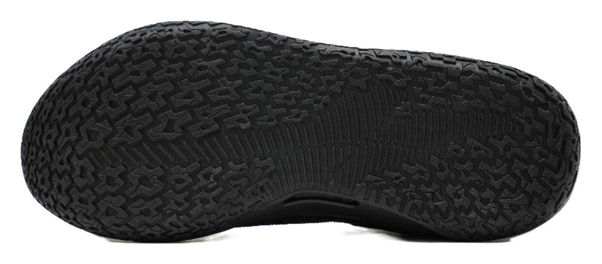 Black rubber basketball shoe outsole with deep tread pattern.